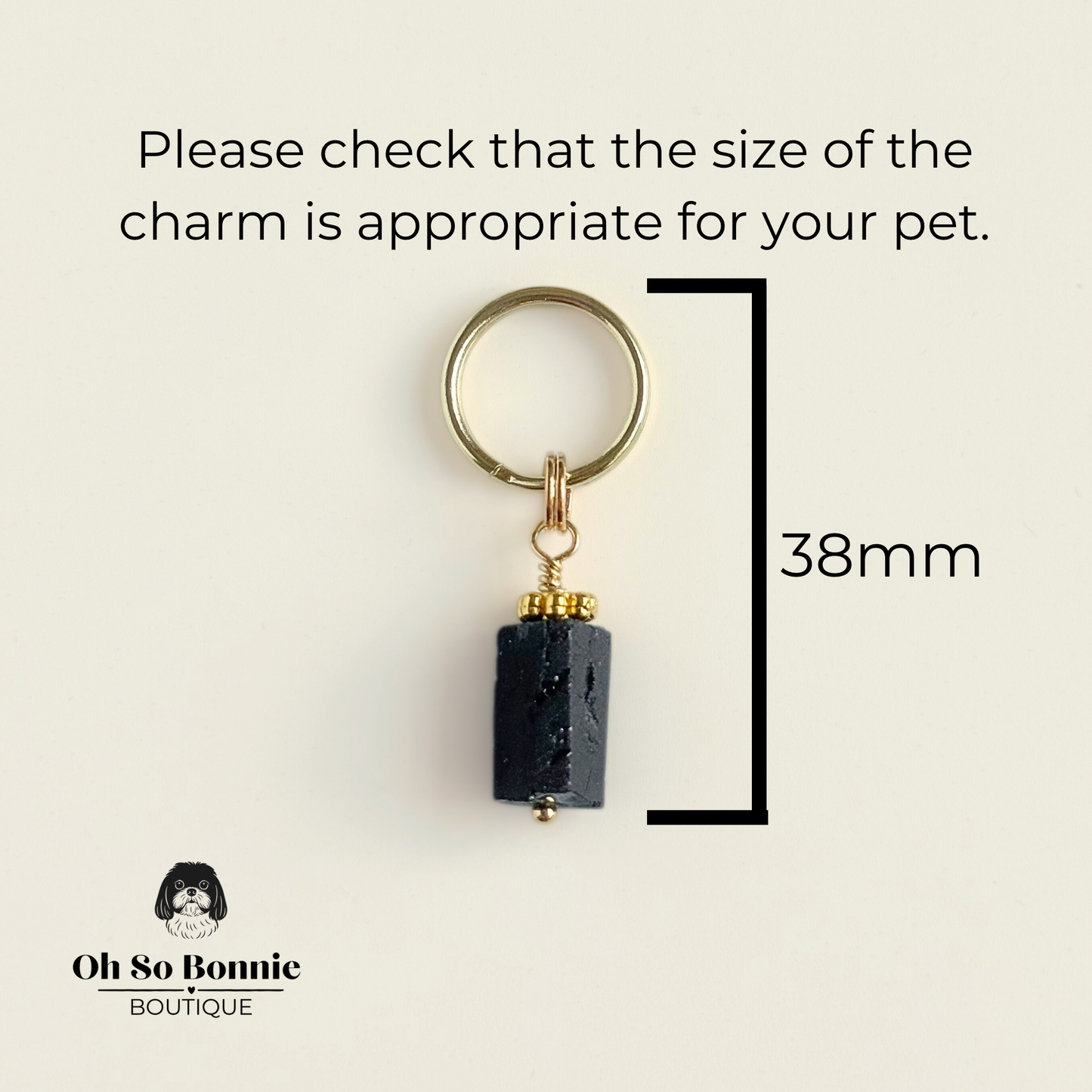 Crystal dog collar charm featuring a raw black tourmaline natural bead with gold plated accents. Featuring a brass split ring for easy attaching to your pet’s collar. Pictured showing dimensions.