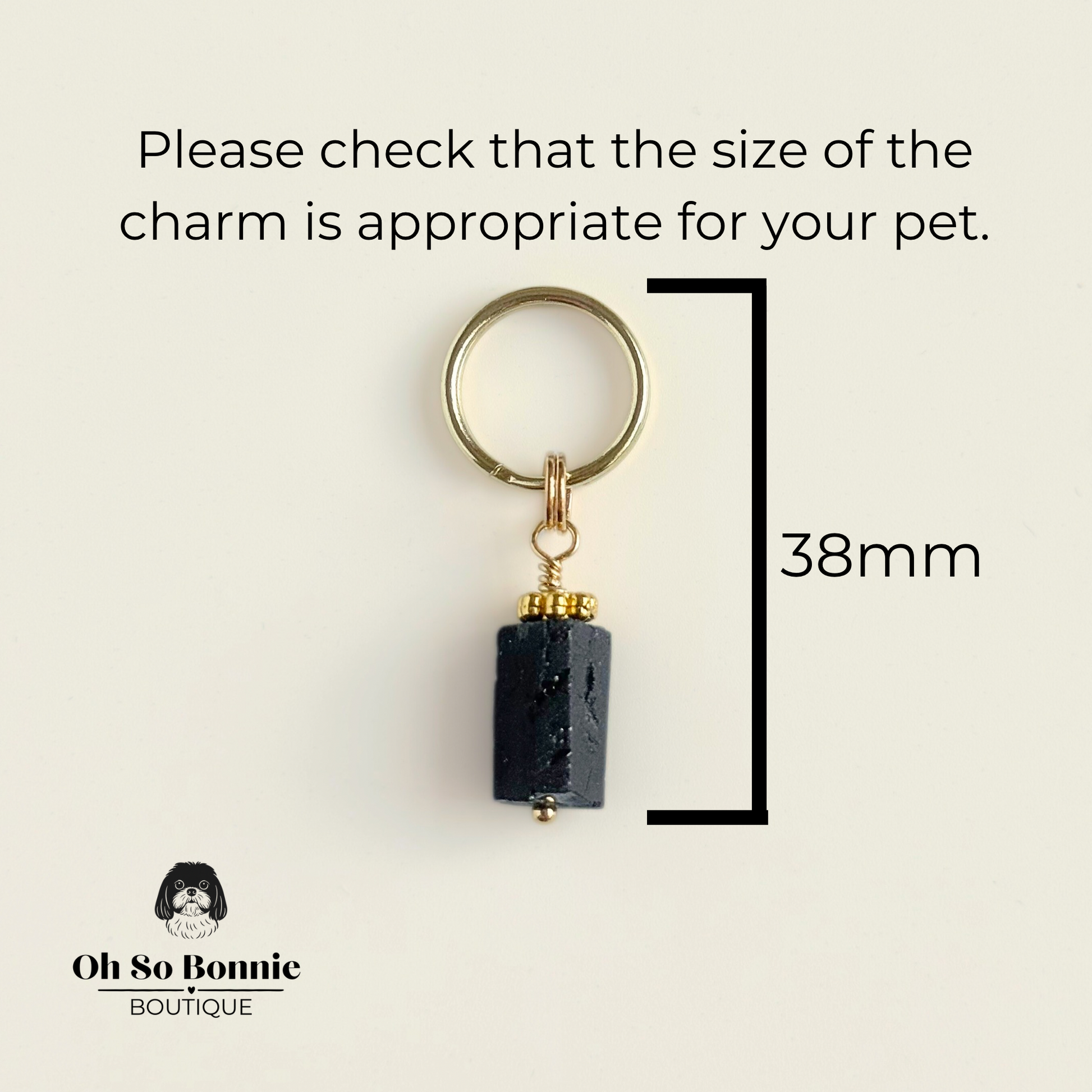 Crystal dog collar charm featuring a raw black tourmaline natural bead with gold plated accents. Featuring a brass split ring for easy attaching to your pet’s collar. Pictured showing dimensions.