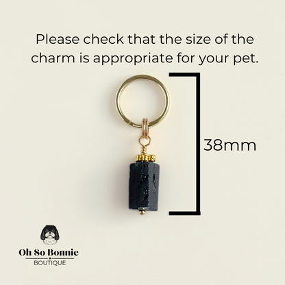 Crystal dog collar charm featuring a raw black tourmaline natural bead with gold plated accents. Featuring a brass split ring for easy attaching to your pet’s collar. Pictured showing dimensions.