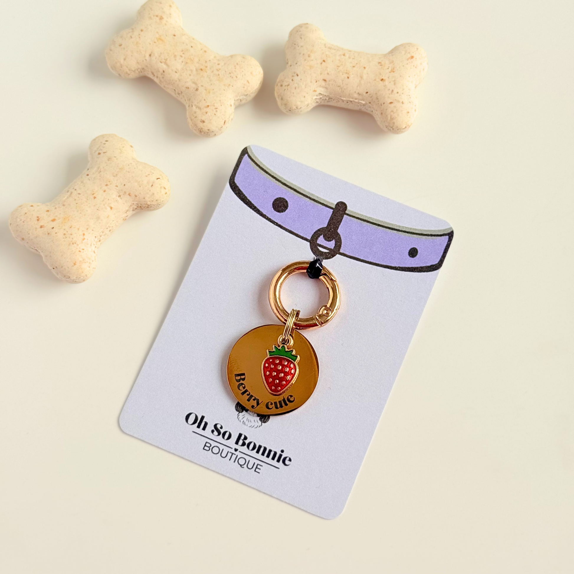 Gold red strawberry dog collar ID tag, Enamel fruit charm with dog name and address details. easily clips onto collar or harness. Shown on the display card.