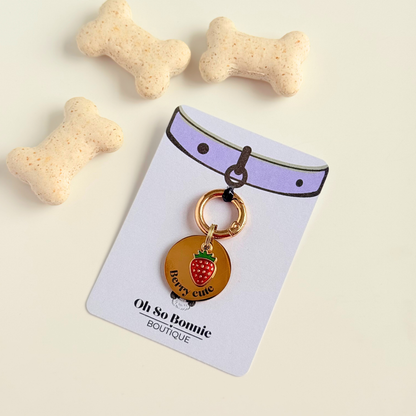Gold red strawberry dog collar ID tag, Enamel fruit charm with dog name and address details. easily clips onto collar or harness. Shown on the display card.