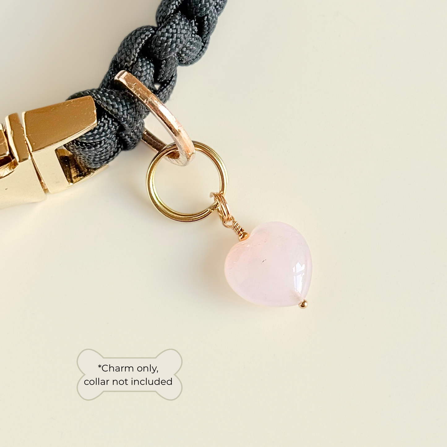 Handmade dog collar charm featuring a 15mm pink rose quartz natural gemstone crystal bead. Hung on a gold plated brass split ring that attaches onto your pet collar. Rose quartz can help pets with love, comfort and calming. Pictured attached to a black collar.