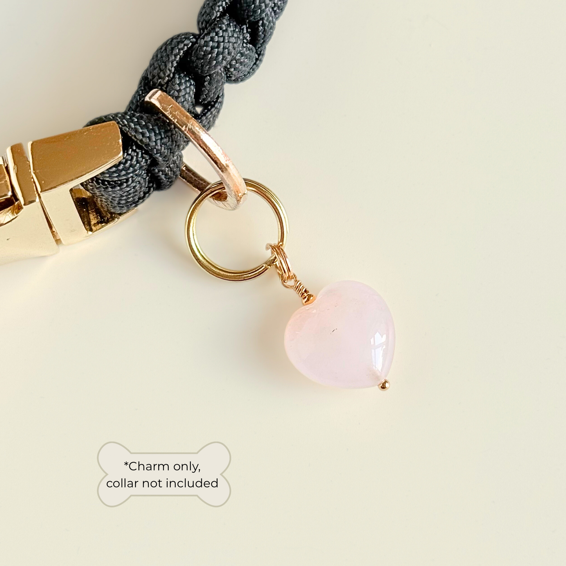 Handmade dog collar charm featuring a 15mm pink rose quartz natural gemstone crystal bead. Hung on a gold plated brass split ring that attaches onto your pet collar. Rose quartz can help pets with love, comfort and calming. Pictured attached to a black collar.