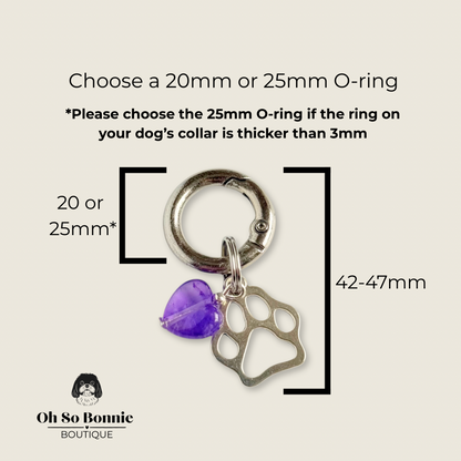 Crystal for dogs pet collar charm featuring a 10mm purple amethyst heart shaped bead and a brass silver coloured paw print tag. Pictured showing dimensions.