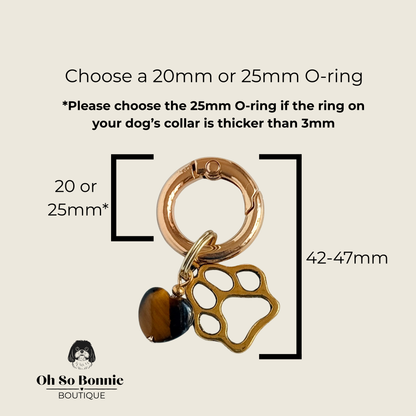 Crystal for dogs pet collar charm featuring a 10mm tigers eye heart shaped bead and a brass gold coloured paw print tag. Pictured showing dimensions.