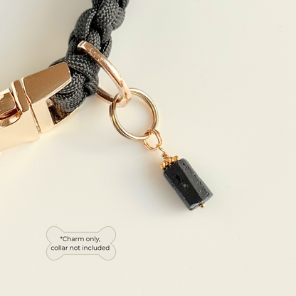 Crystal dog collar charm featuring a raw black tourmaline natural bead with gold plated accents. Featuring a brass split ring for easy attaching to your pet’s collar. Pictured attached to a black paracord dog collar. 