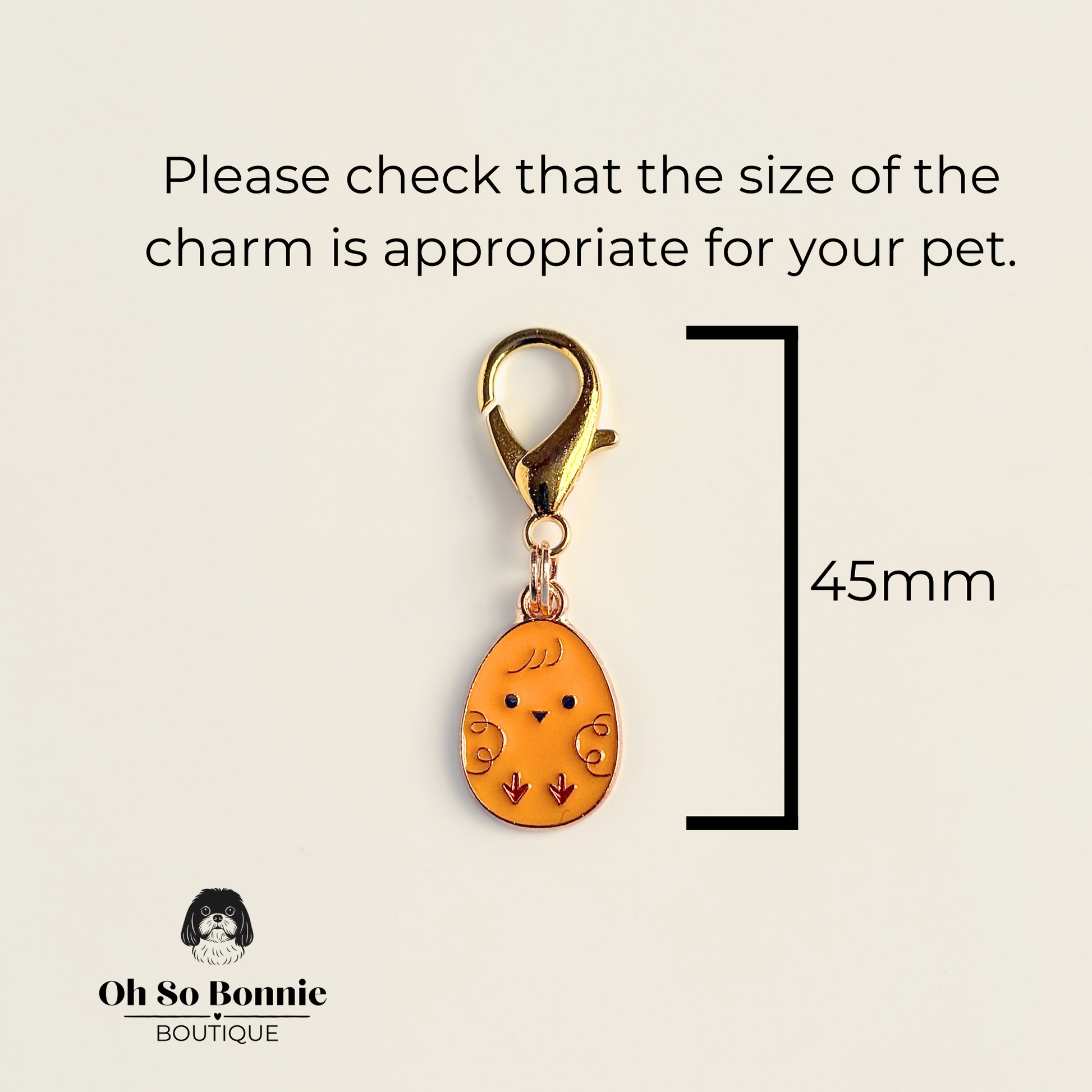 Yellow chick Easter egg enamel dog collar charm that easily attaches to collars and harnesses with a gold plated lobster clasp. Pictured showing the dimensions.