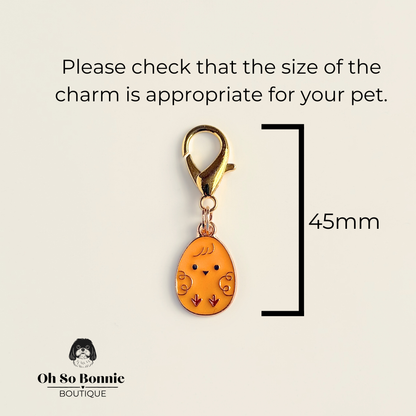 Yellow chick Easter egg enamel dog collar charm that easily attaches to collars and harnesses with a gold plated lobster clasp. Pictured showing the dimensions.