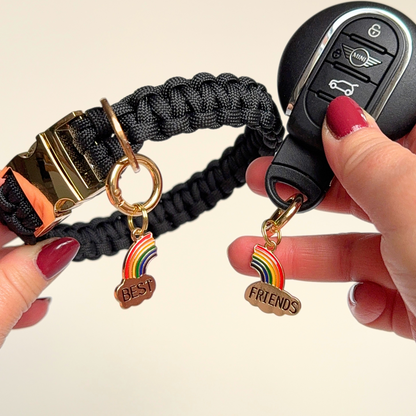 Set of two ‘best friends’ matching dog collar charm and keyring. With enamel rainbow gold plated charms, on secure carabiner style O-rings, for easy use. Pictured showing one attached to a collar, one to a car key.