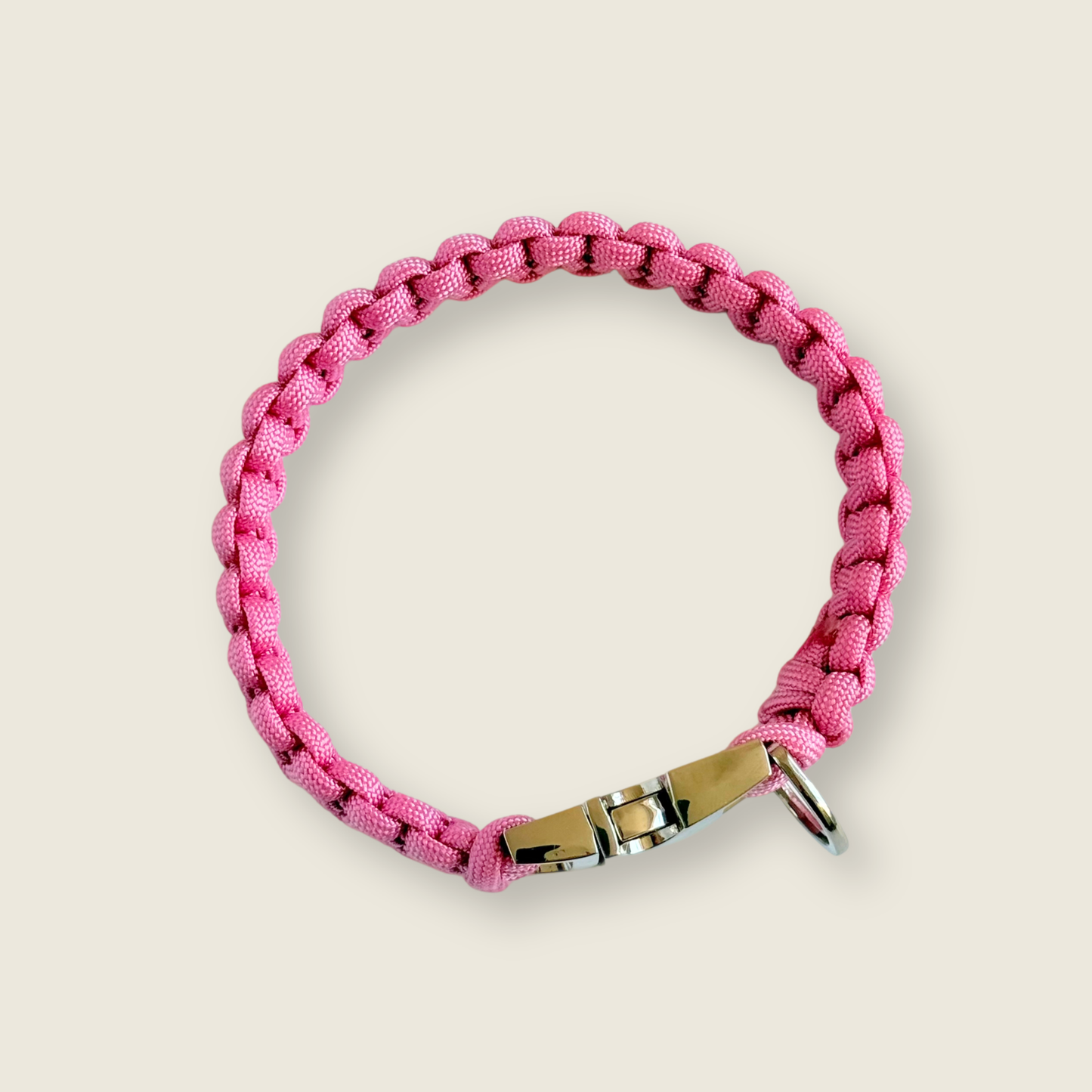 ‘Lavender pink’ handmade paracord dog collar with silver coloured buckle clasp. Custom made to your required size. Braided macrame style pet neckwear. Pictured from above.