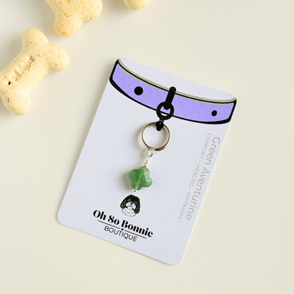 Green aventurine four leaf clover shaped crystal dog collar charm. Crystals for dogs, gemstone for optimism, healing and comfort. Pictured on the display card.
