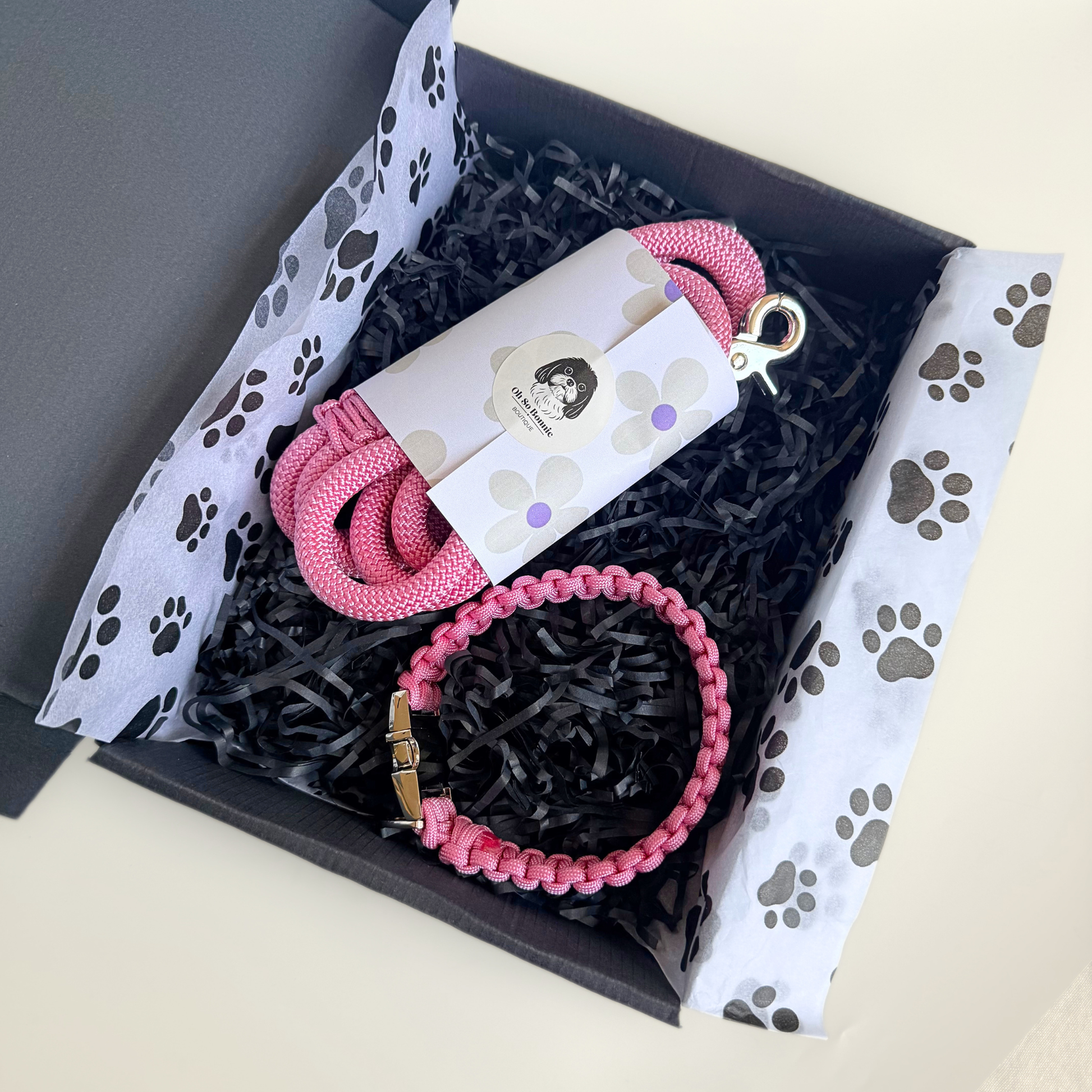 Custom made pink nylon rope dog collar set with matching paracord braided dog collar. Picture showing the collar and lead inside the gift box.