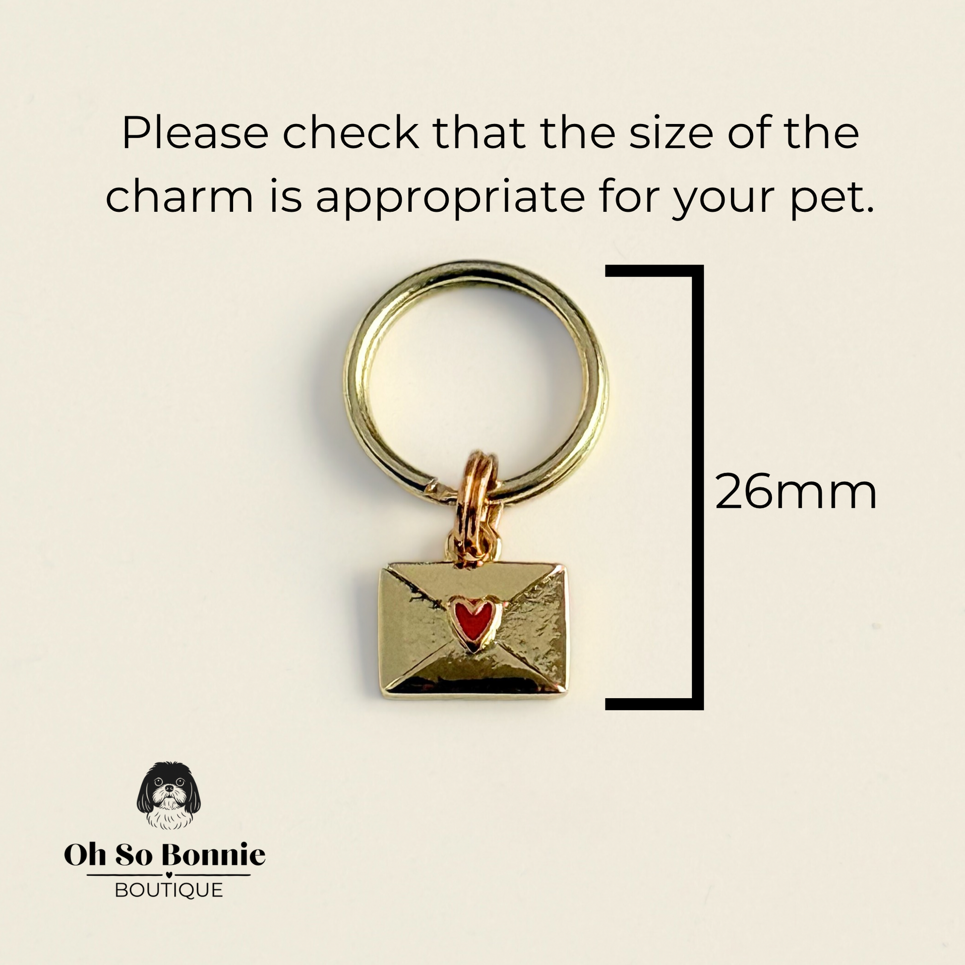 Gold plated brass envelope dog collar charm featuring a red enamel heart. Pictured with the dimensions of the charm listed.￼