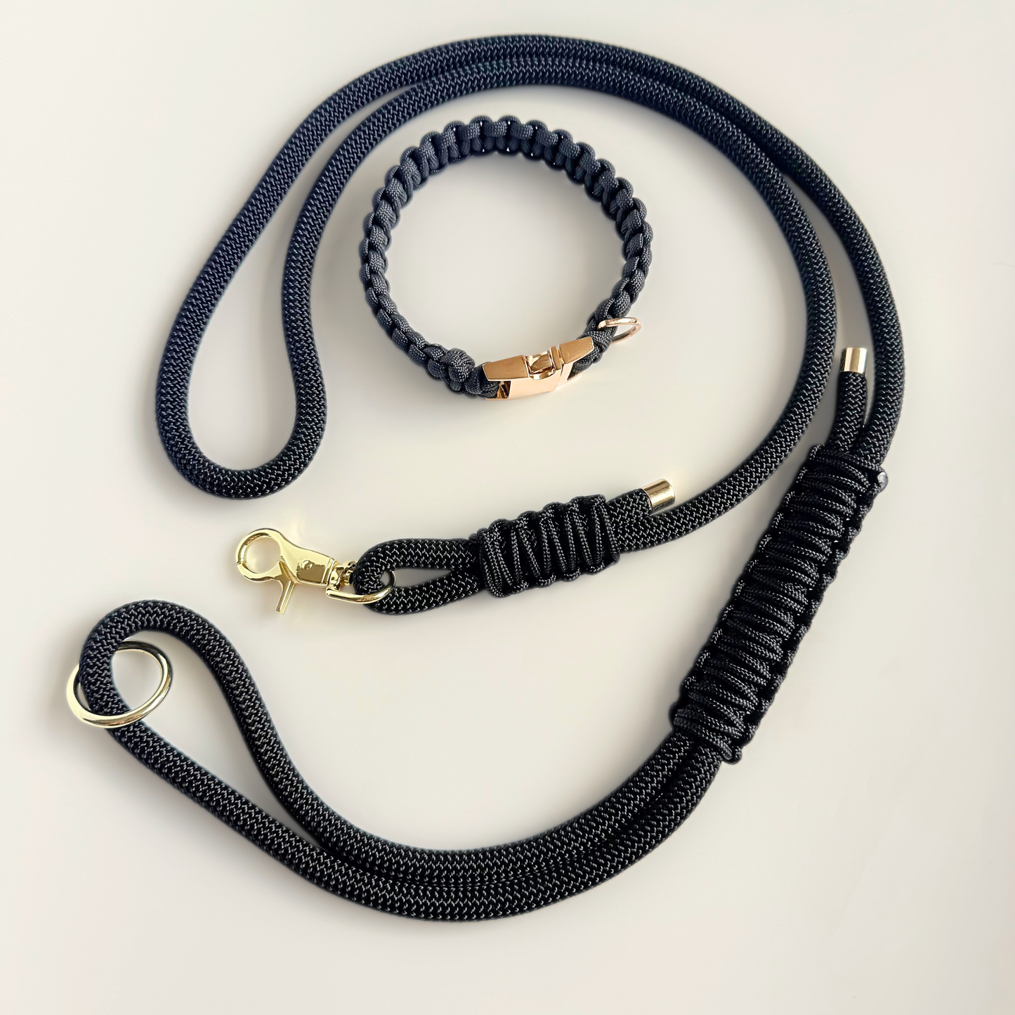 Custom made black nylon rope dog collar set with matching paracord braided dog collar. Picture shows gold hardware option.
